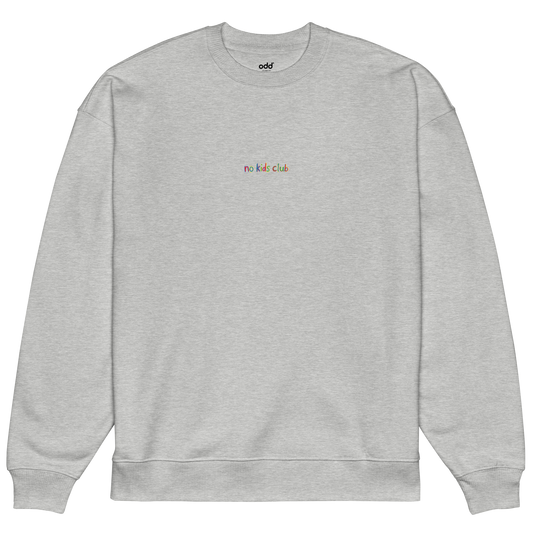 Heather grey oversized sweatshirt, front view – "no kids club" multicolor embroidery on chest