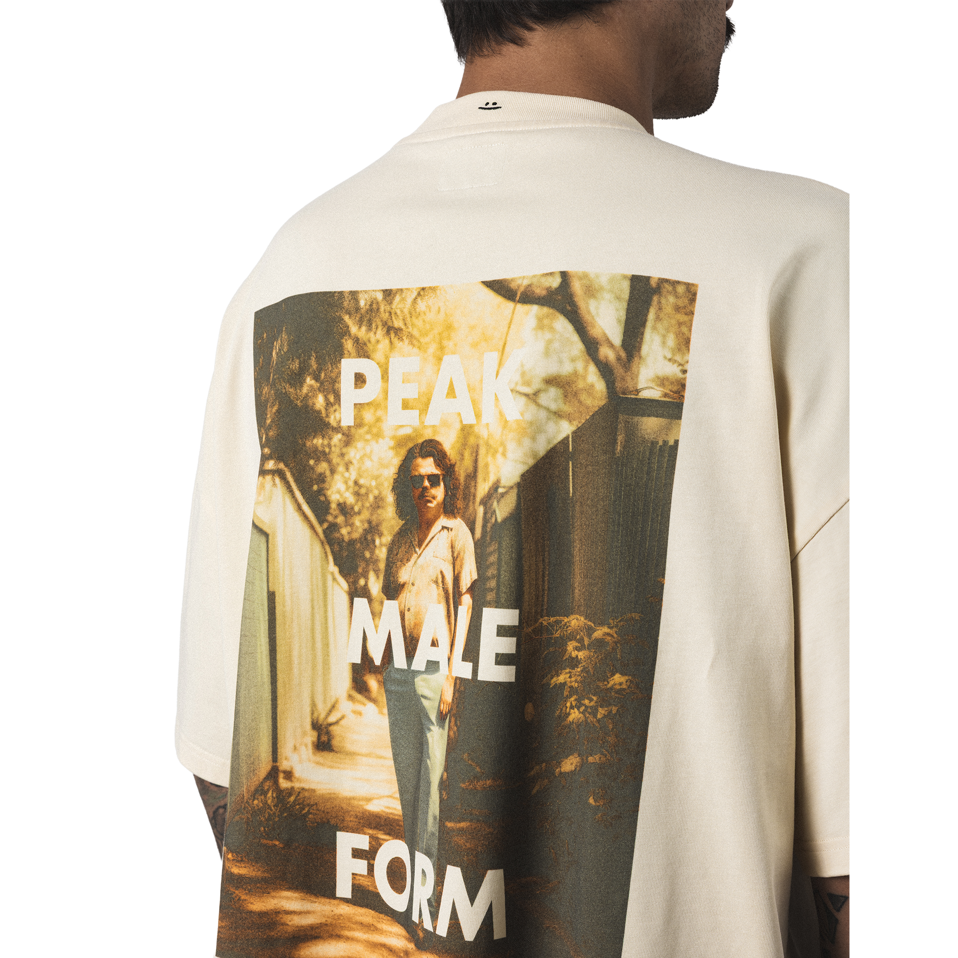 Oversized heavy cotton t-shirt back closeup model view minimalist peak male form design back print with smiley embroidery