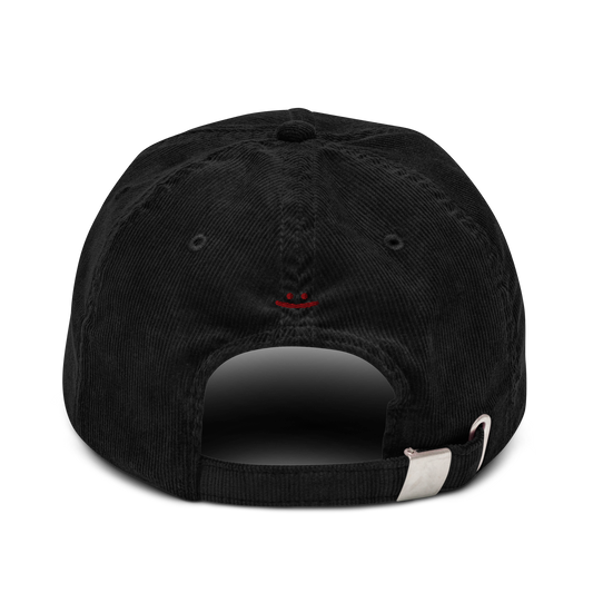 oddjuice trash cap – back view showing adjustable silver buckle strap on black cap and small embroidered smiley