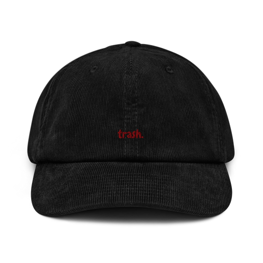 oddjuice trash cap – black corduroy 6-panel dad cap with small red "trash" embroidery on front, front view