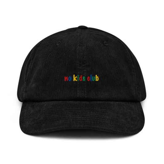 Black corduroy cap, front view – "no kids club" multicolor embroidery on crown