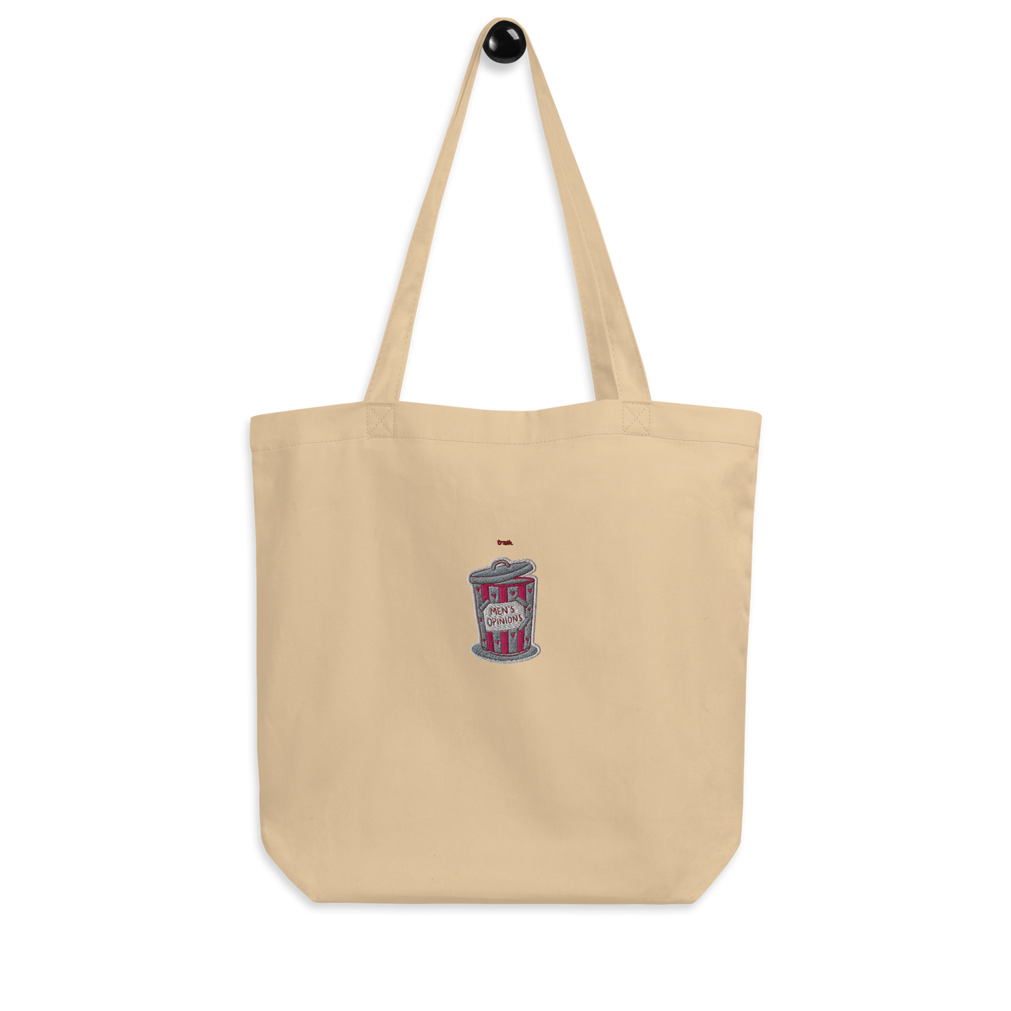 oddjuice trash bag – natural beige organic cotton tote bag with small pink trash can "mens opinions" embroidery on front, full view