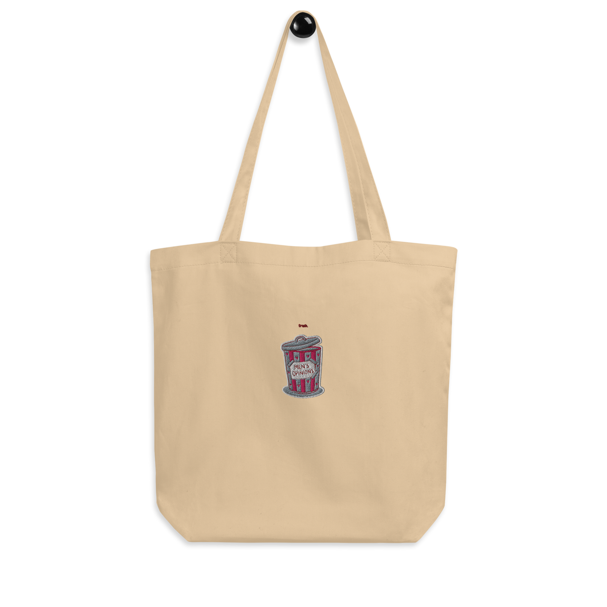 oddjuice trash bag – natural beige organic cotton tote bag with small pink trash can "mens opinions" embroidery on front, full view