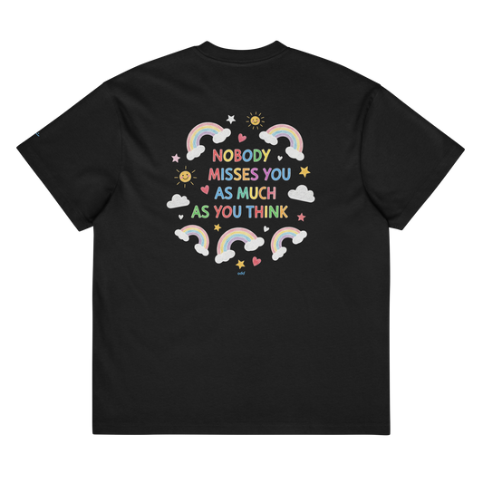 black boxy oversized unisex t-shirt, back view, "nobody misses you as much as you think" with happy little hearts, suns, stars, clouds and rainbows in crayon print