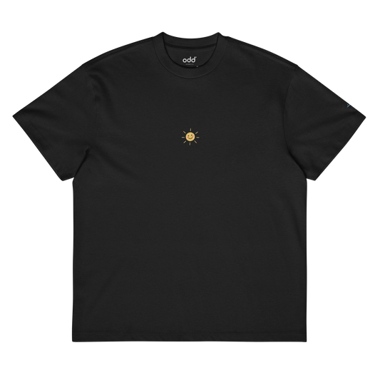 black boxy oversized unisex t-shirt, front view, happy little sun in crayon print