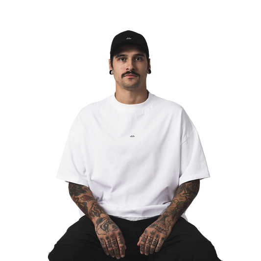 Minimalist black cap with embroidered smiley design streetwear style model front view