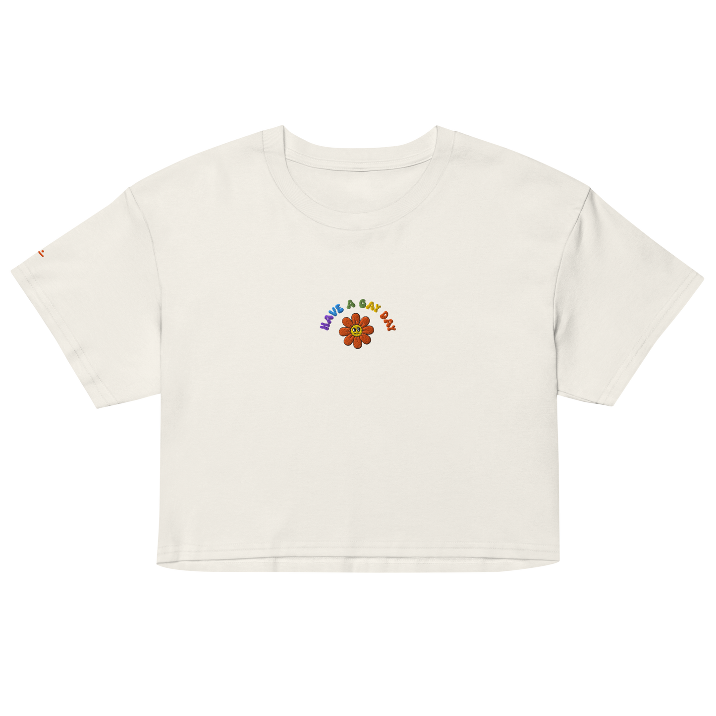Off-White crop top, front view – small colorful"have a gay day" and flower with friendly face embroidery on chest