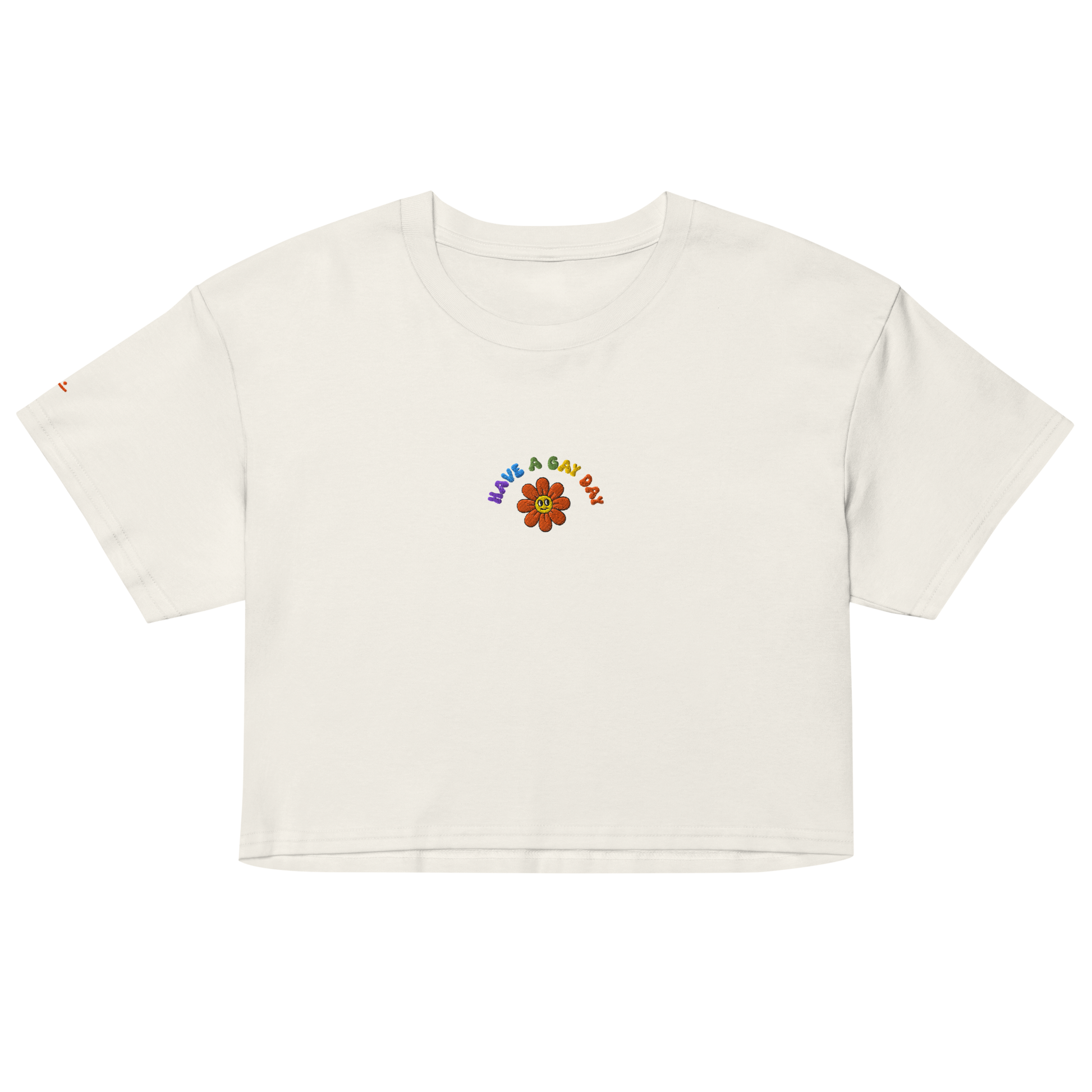 Off-White crop top, front view – small colorful"have a gay day" and flower with friendly face embroidery on chest