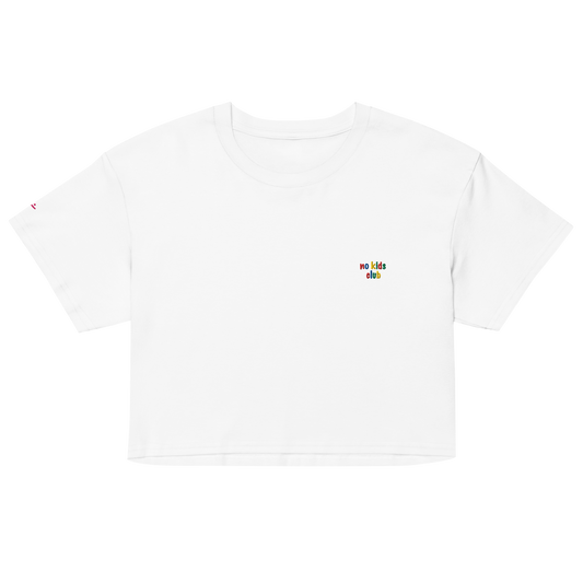 White crop top, front view – small "no kids club" embroidery on chest